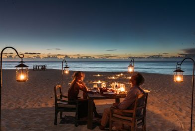 1-North-Island-Experience-the-Island-couple-on-beach-at-dinner-2048x1366