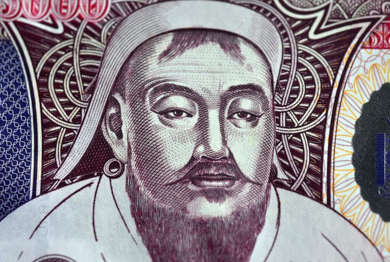 a portrait of gengis khan on a mongolian banknote