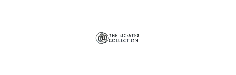 The Bicester Collection logo centered on a black background, with a white rounded rectangle and circular emblem next to the text.